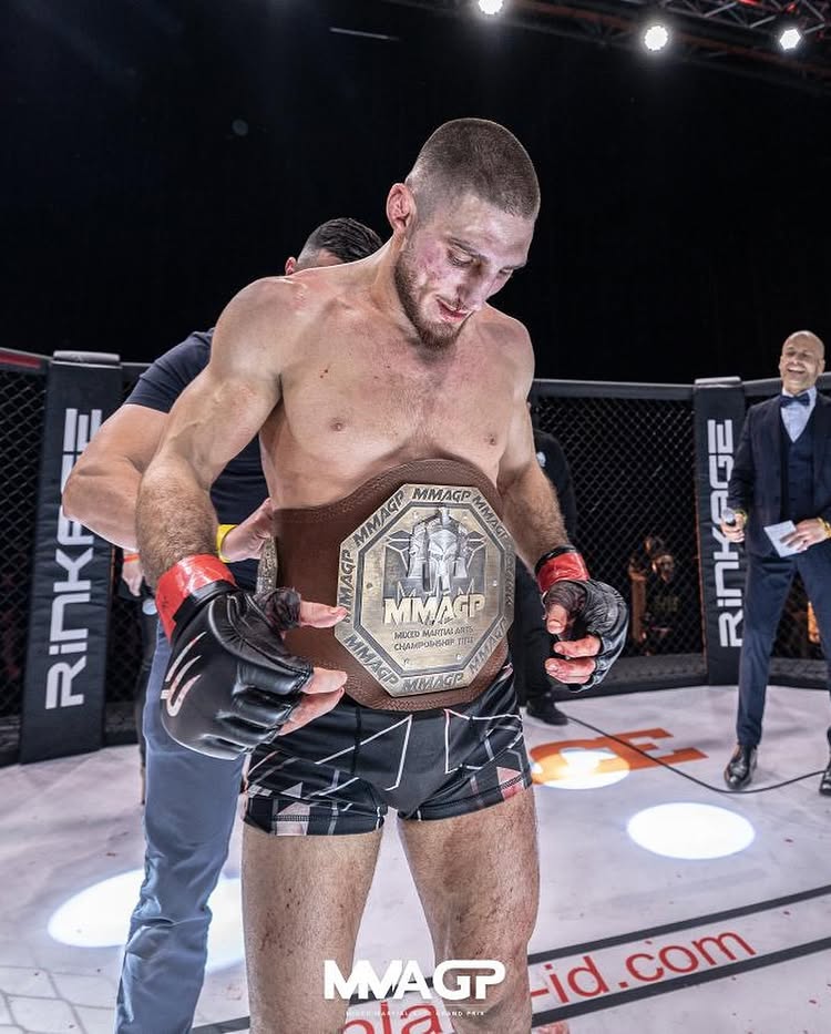 Michael Aljarouj MMA GP champion in the cage