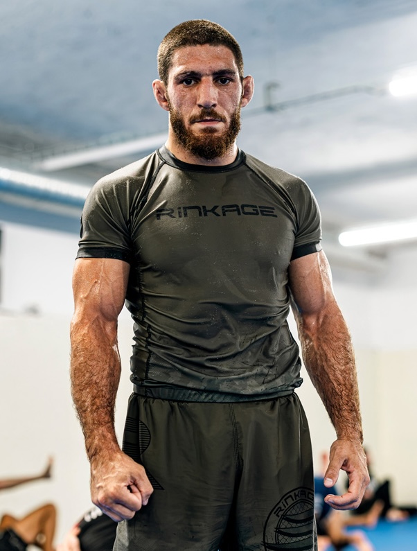 Michael Aljarouj standing in Rinkage rashguard at Old School Academy